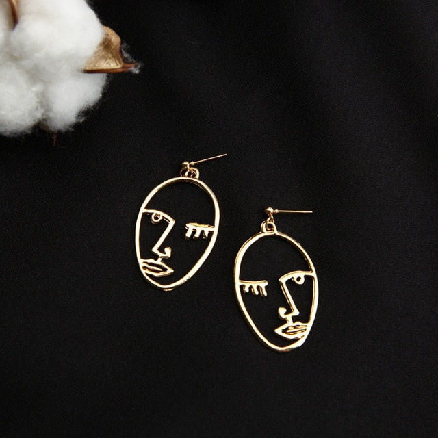 Abstract Stylish Hollow Out Face Dangle Earrings