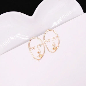 Abstract Stylish Hollow Out Face Dangle Earrings